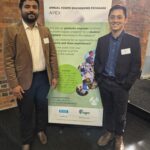 APEX 2024 Christy Tom and Henry Bui Young engineers Christy Tom and Henry Bui from PowerNet stand infront of APEX banner