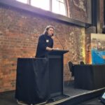 APEX 2024 Nicholas Davies Young engineer Nicolas Davies of Beca presents to the audience