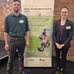APEX 2024 William Thomas and Abigail Field Award winners and young engineers William Thomas and Abigail Field stand infront of an APEX banner